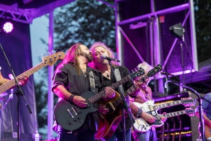 2 males performers singing on stage at Greenfield park concert 